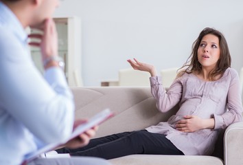 Pregnant woman visiting psychologist doctor