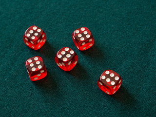 red dices on green cloth casino gambling luck