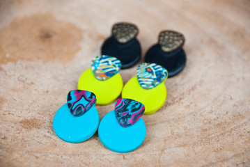 Three pairs of handmade bright boho earrings of polymer clay.