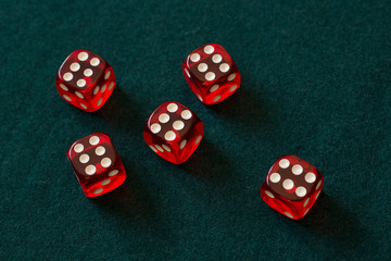 red dices on green cloth casino gambling luck