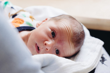 Authentic photography of a newborn with slightly lower birth weight. 