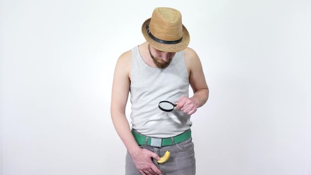 Inspection of the penis through a magnifying glass.Small penis problem men.