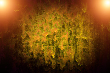 Abstract background dripping yellow paint from rusty metal.