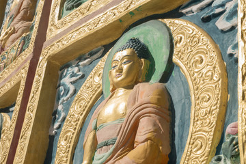 golden statue of buddha in leh, ladakh