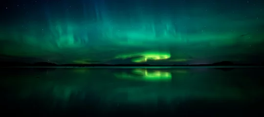 Zelfklevend Fotobehang Northern lights dancing over calm lake. Farnebofjarden national park in Sweden. © Conny Sjostrom