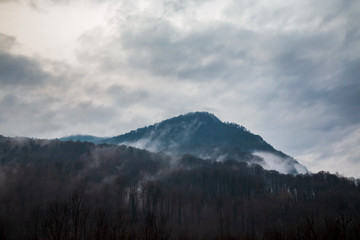 low clouds and fog high in the mountains at dusk
