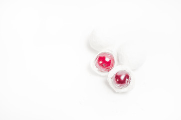 Cranberries in powdered sugar on white background. Copyspace