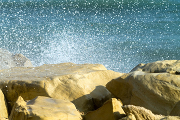 Rocks with sea wave spray
