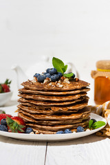 stack of homemade pancakes for breakfast, vertical