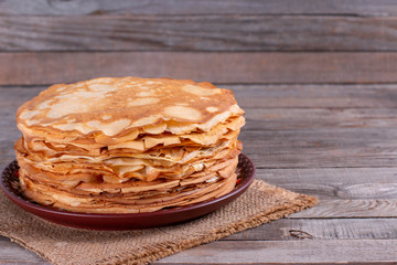 Stack of thin pancakes in a plate