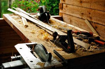 Carpenter's tool on a workbench set outdoors
