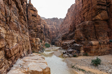 The entrance of Wadi Al Mujib reserve and canyon in Jordan in winter - obrazy, fototapety, plakaty