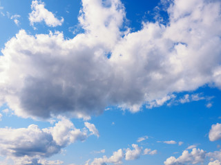 Naklejka na ściany i meble White clouds on a blue sky background