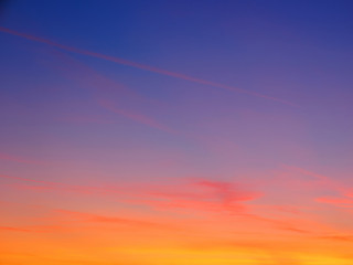 Clouds on orange sunset sky