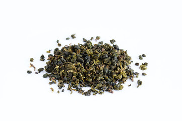 Tea in bulk with lotus flowers on a white background close-up