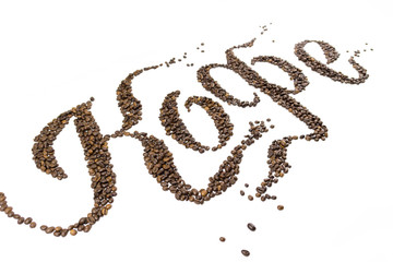 beans spelling the word coffee break and some beans on the bottom isolated on white background.