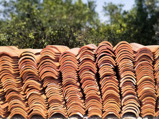 Brown ceramic tiles stacked in close-UPS. Building material.