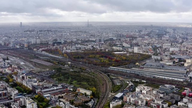 Paris aerial city urban view in France feat. residential suburban houses in Saint Denis neighborhood with railway and train high angle view from above