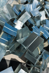 Fototapeta premium metal scraps in the form of shiny cubes in an industrial plant