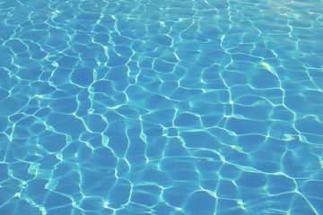 Fototapeta na wymiar surface of blue swimming pool,background of water in swimming pool.