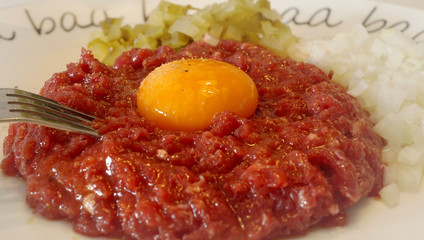 steak tartare - raw, chopped meat and yolk