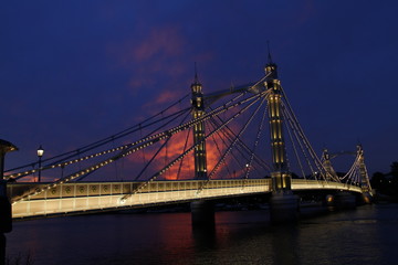 Albert Bridge, London,UK. View of Albert Bridge in the evening sunset with lights on the bridge being on.