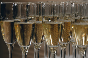 glasses of white sparkling wine champagne lot of close-ups
