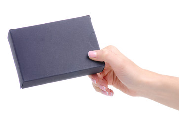 Black box package in hand on white background isolation