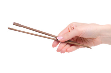 chopsticks in hand on a white background isolation