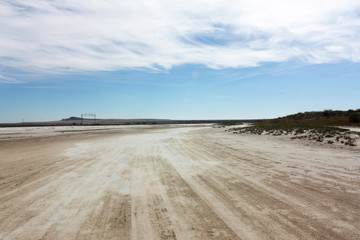 The road on the salt lake Baskunchak in the Astrakhan region of Russia. Salt Mining Site