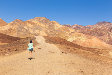 Woman on a path, Death Valley, USA.