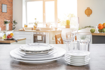 Set of clean tableware on white background