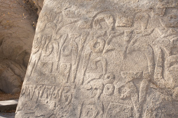 buddhist mantras carved in stone