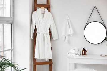 Soft clean bathrobe in light bathroom