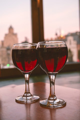 two glasses of red wine on the table in the restaurant, romantic dinner concept