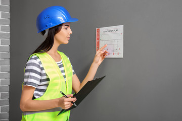 Fire safety specialist inspecting building