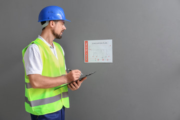 Fire safety specialist inspecting building