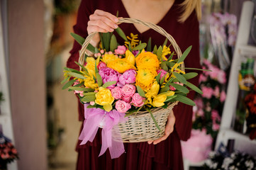 Close-up of peonies and roses in basket