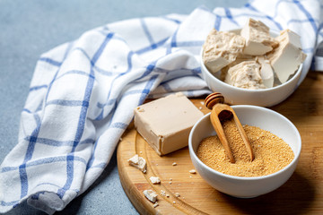 Different types of yeast in ceramic bowls.
