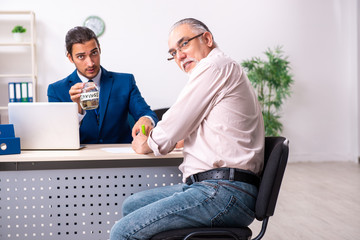 Financial advisor giving retirement advice to old man