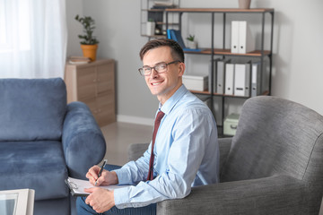 Portrait of male psychologist in office