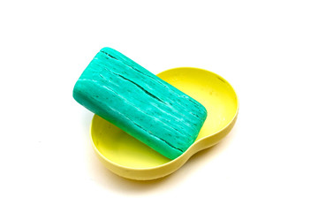 blue dry toilet soap with cracks on a white background