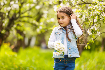 Beautiful girl in flowering Apple trees. Long hair