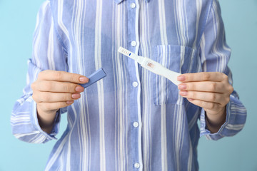 Young woman with pregnancy test, closeup