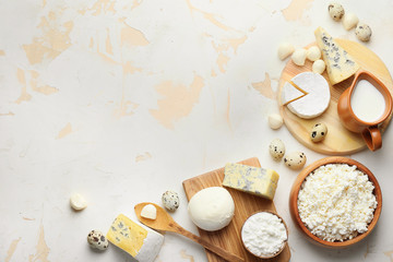 Different dairy products on light background