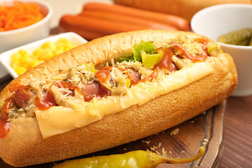 Tasty hot dog on table