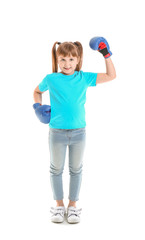 Little girl in boxing gloves on white background. Concept of feminism