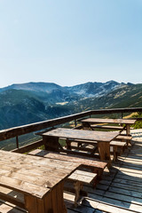 Wooden Tables and Benches with Mountain View