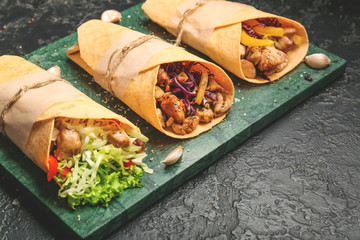 Tasty doner kebab on dark background