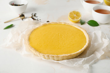 Tasty homemade lemon pie on table